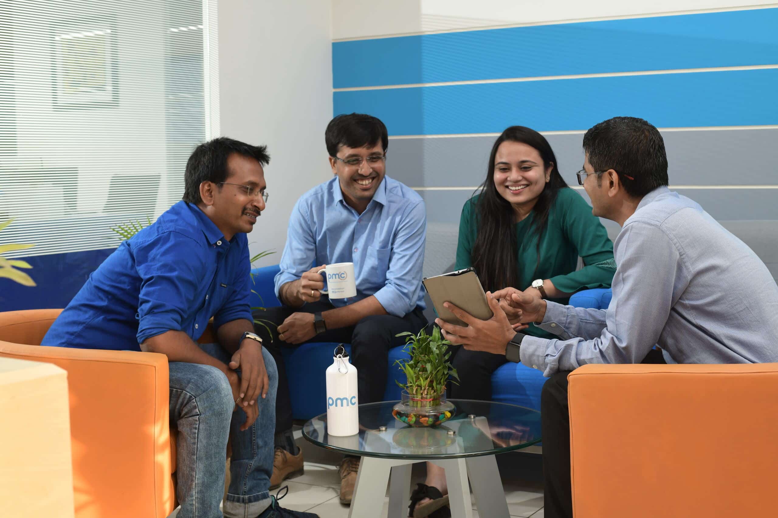 PMC employee happily discussing